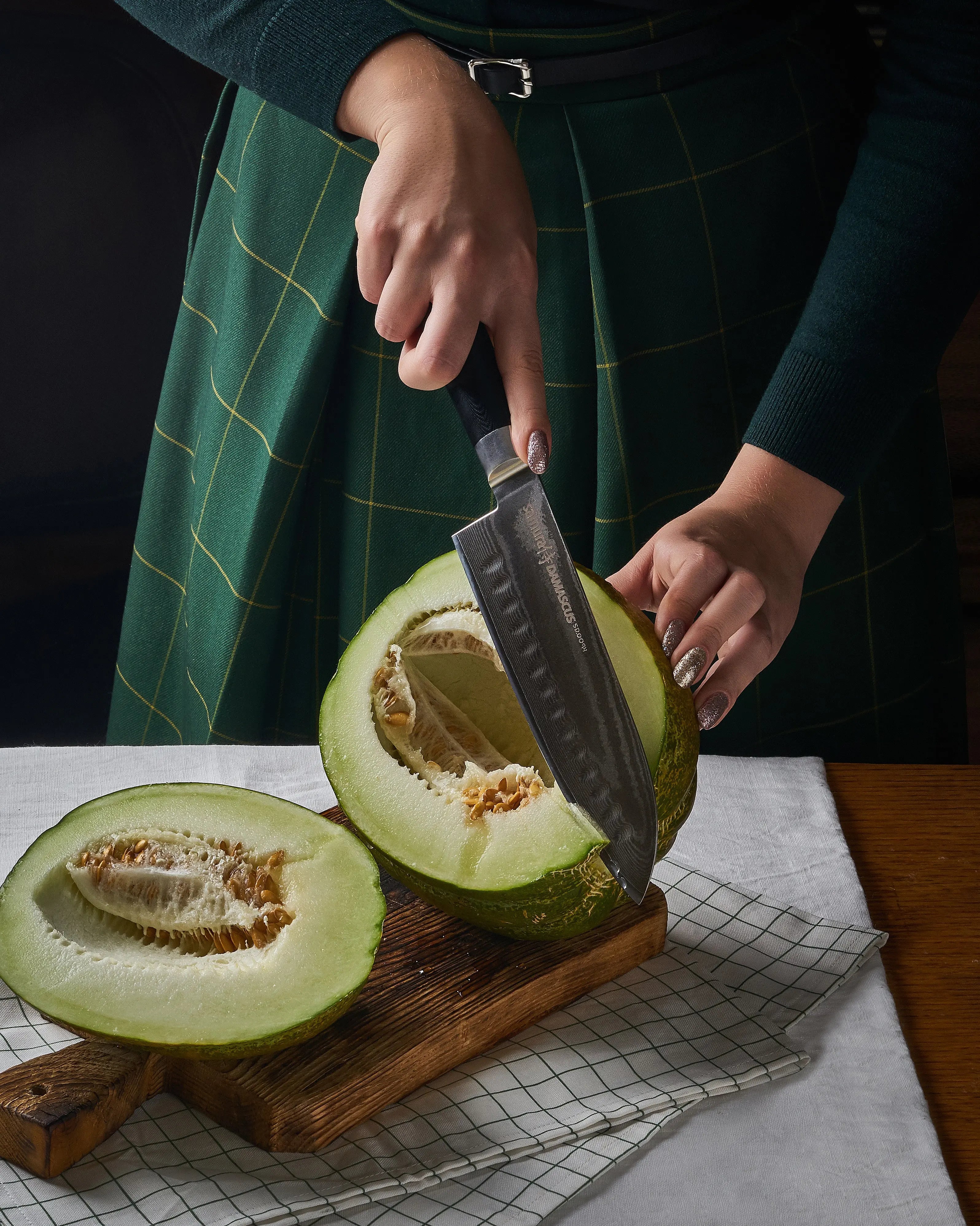 Precision Knives Samura Damascus Santoku Knife slicing a watermelon