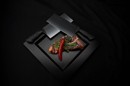 Precision Knives Samura Arny knives overlapping on a plate with a steak and a chilli pepper